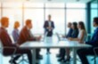 © Pete - Blurred business people in modern boardroom. Group of adults sits around conference table. Person stands, speaks in front of. Discuss projects business ideas. High tech office interior with light,