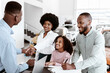 © Prostock-studio - Its a deal. Positive black family buying new car, shaking hands with salesman, signing auto purchase agreement at dealership. Cheerful Afro clients shopping for automobile at automotive showroom