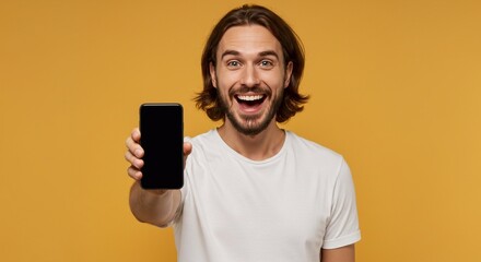 Mobile Application Ad. Portrait Of Excited Man Showing Smart Phone Black Empty Screen Recommending App Standing Over Yellow Orange Studio Background. Cellphone Display Mock Up, Check This Website
