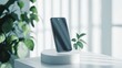 © abdul kahfi - Modern Smartphone Display on Minimalist Stand with Greenery