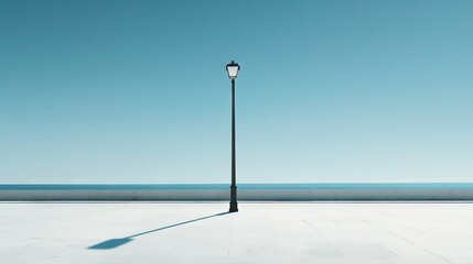 Wall Mural - minimalist street lamp casting a long shadow under a clear blue sky, evoking simplicity and elegance