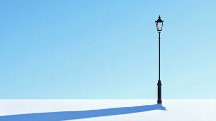 Wall Mural - minimalist street lamp casting a long shadow under a clear blue sky, evoking simplicity and elegance