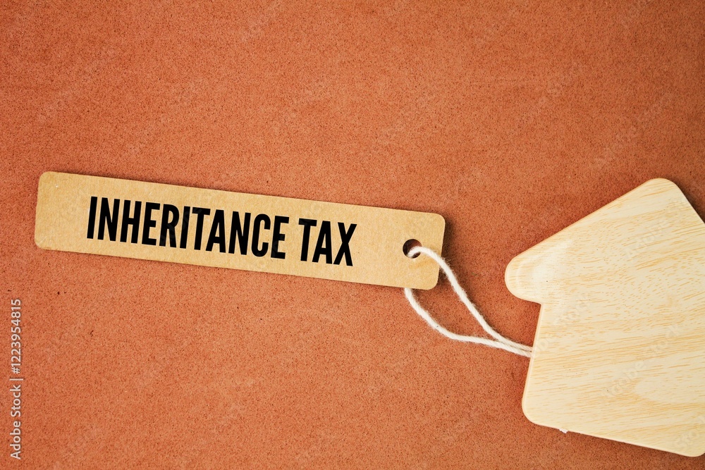 Foto de Stock house form and paper tag with the word Inheritance Tax. An inheritance tax is a