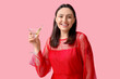 © Pixel-Shot - Happy young woman holding glass of tasty martini with olives on pink background