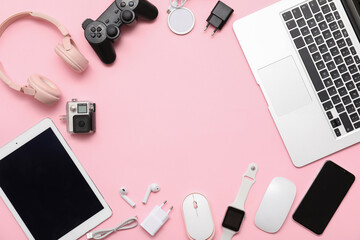 Wall Mural - frame made of modern devices on pink background