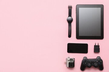 Wall Mural - set of modern devices on pink background, top view