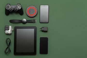 Wall Mural - set of modern devices on dark green background, top view