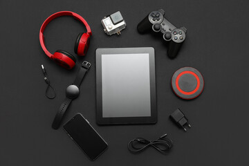 Wall Mural - set of modern devices on black background, top view