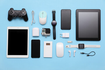 Wall Mural - set of modern devices on blue background, top view