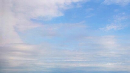 Wall Mural - Beautiful fluffy clouds drifting across a bright blue sky during a sunny afternoon in a peaceful outdoor setting. Calm and romantic background with clouds on the weather theme.