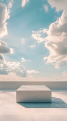 Wall Mural - a podium set in front of a vast, open sky with soft clouds and gentle light casting long shadows acr