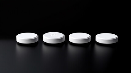 White pills isolated on a black background