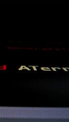 Wall Mural - closeup macro shot movement of coding script moving across led screen with real-time ai-generated ty