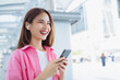 © sitthiphong - Beautiful young Asian woman using smartphone in public areas, During leisure time. The concept of using the phone is essential in everyday life.