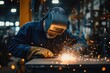 © Aleksandra - Skilled Welder Working with Sparks and Intense Focus in Industrial Workshop