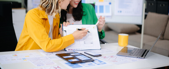 Wall Mural - woman people meeting team brainstorming on their project with laptop, smartphone and digital tablet.