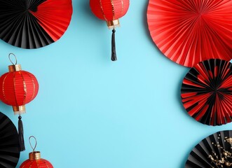 Wall Mural - Top view flat lay of red and black paper fans with Chinese lanterns on a blue background, with copy space .