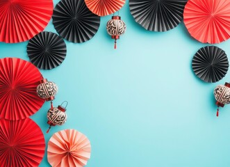 Wall Mural - Top view flat lay of red and black paper fans with Chinese lanterns on a blue background, with copy space .