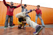 © pressmaster - Breakdancing Performance by Group of Young Men Outdoors