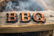 © Kymaka28 - burning BBQ letters on wooden background.