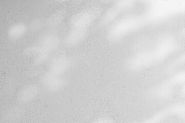 close up on white plain wall background texture with shadow of window from sunlight for ads and adve