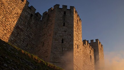 Poster - An enchanting shot of a medieval castle perched atop a foggy hill, golden morning light illuminating its ancient walls.