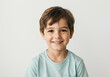 © DariaTrofimova - Portrait of a laughing boy of 6-7 years old in a T-shirt on a light background