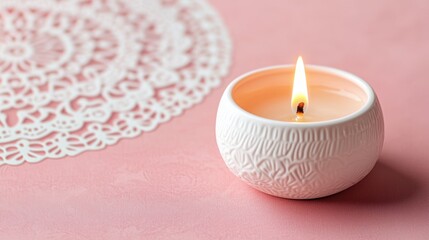 Wall Mural - Serene and Tranquil Burning Candle with Embossed Ceramic Holder on Pink Background