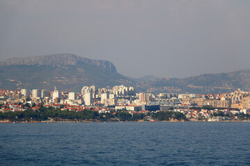 Wall Mural - Contemporary buildings, gardens and beaches at the waterfront in Split, Croatia. View of Split from the boat.