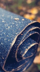 Poster -   A close-up of blue leather with gold speckles on both sides