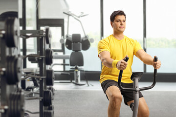 Sticker - Young man riding an exercise bike