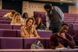 © DusanJelicic - University professor helping students during lesson in lecture hall