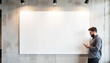 © Dmitry - Man using phone next to blank wall in modern interior