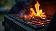 © vattana - Close-up view of a vibrant flame grilling grate with glowing embers and wisps of smoke