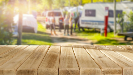 Wall Mural - wooden table with copy space and sun rays on a beautiful summer day.