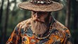 © The 2R Artificiality - Bearded middle-aged man wearing a colorful painted shirt and birchbark hat surrounded by lush green forest foliage in natural light