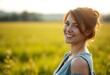 © iushakovsky - Portrait of a smiling female outdoors in a meadow