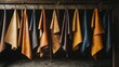 © Kittichet - Various colored towels hanging on a wall in a bathroom setting leather and tannery