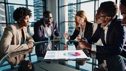 Aufkleber - Professionals engage in discussion during a business meeting in a modern office overlooking the city skyline