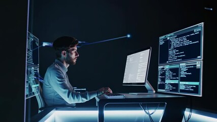 Leinwandbilder - Coding in the dark with multiple screens showcasing complex programming tasks