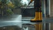 © muhammad - Person power washing pavement, urban background