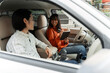 © Maria Vitkovska - Business partners discussing strategy inside car during business trip