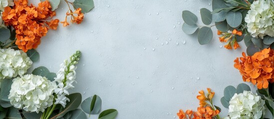 Wall Mural - Vibrant Hydrangea and Orange Hyacinth Floral Arrangement with Large Eucalyptus Leaves on Light Grey Background Top View Empty Copy Space for Text