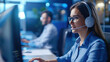 © Vilaysack - technical support agent wearing headset assists employee in modern office setting, focusing on customer service and problem solving