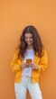 © Best - Young woman sending a message with the mobile