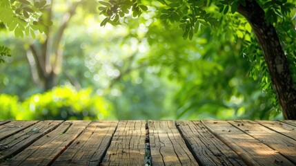 Wall Mural - Empty wooden table with green tree background