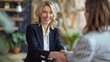 © Mdjual - Happy mid aged business woman manager handshaking greeting client in office. Smiling female executive making successful deal with partner shaking hand at work standing at meeting table