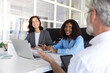 © zinkevych - Bearded businessman in wheelchair leading group of professionals in office