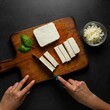 © Sai Pavan - Chef cutting paneer/cottage cheese on chopping board