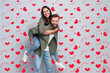© deagreez - Photo of young cheerful lovely couple soulmate romance have fun bonding isolated over grey color background